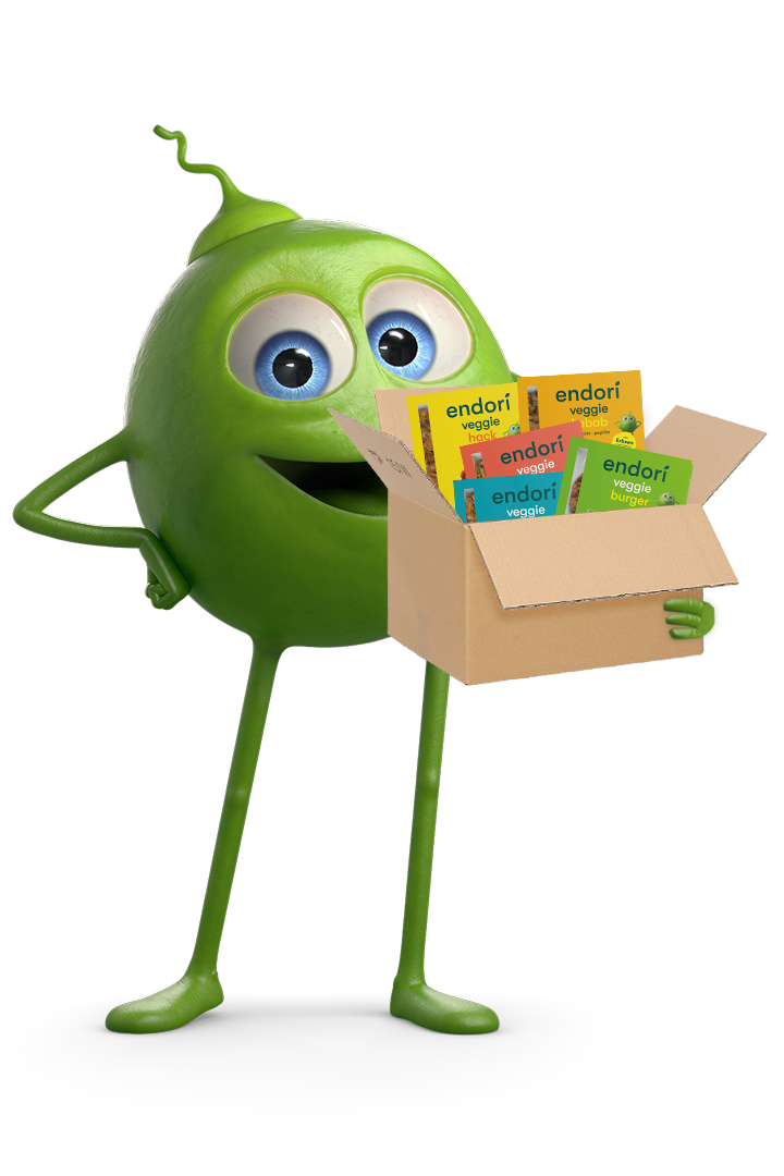 endori Erbse die Box mit endori Produkten in der Hand hält endori Erbse die Box mit endori Produkten in der Hand hält